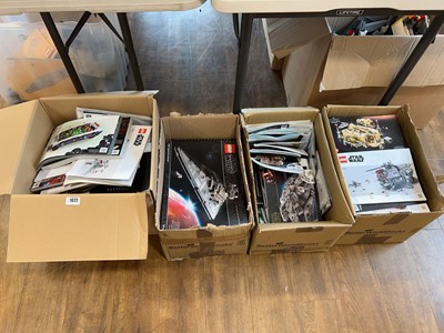 Lot 1072 - 4 boxes containing various Lego model manuals