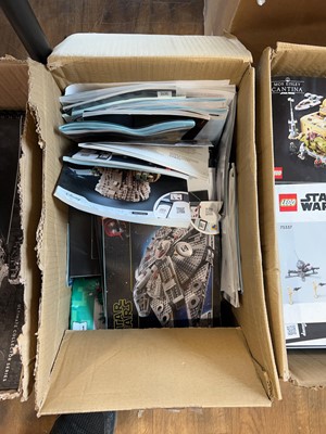 Lot 1072 - 4 boxes containing various Lego model manuals