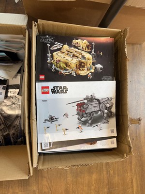 Lot 1072 - 4 boxes containing various Lego model manuals