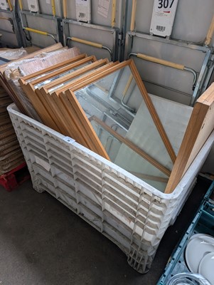 Lot 58 - Approximately 15 wooden framed mirrors in a...
