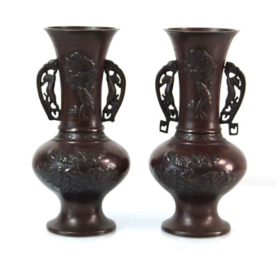 Lot 73 - A pair of 20th century brown-patinated...