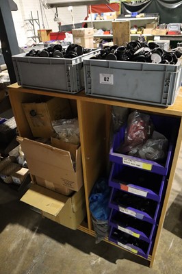 Lot 87 - Open-front wooden shelf unit with contents;...