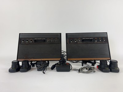 Lot 2 - Two Atari model CX-2600U video computer...
