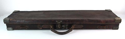 Lot 79 - A leather and brass mounted gun case with...