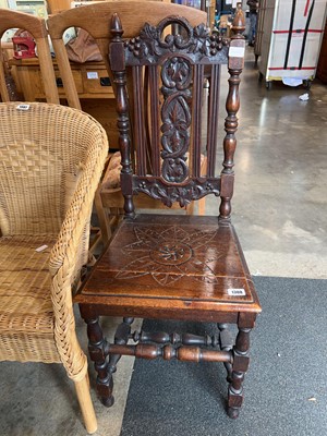 Lot 1308 - Dark oak panel seated chair