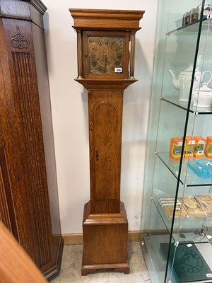 Lot 1314 - Slender dark oak cased grandfather clock with...