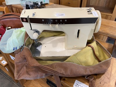 Lot 1327 - Singer electric powered sewing machine in...