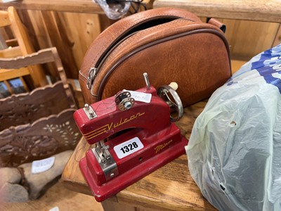 Lot 1328 - Miniature Vulcan hand operated sewing machine...