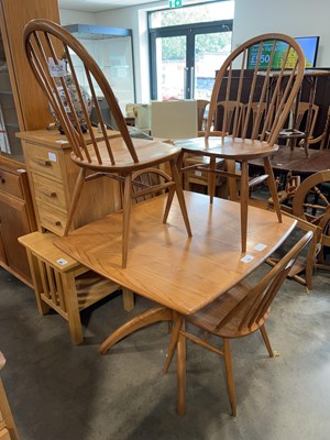 Lot 1335 - Ercol extending dining table with 4 matching...