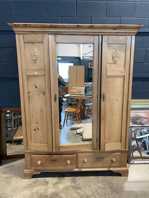 Lot 1435 - Early 20th Century pine triple front wardrobe,...