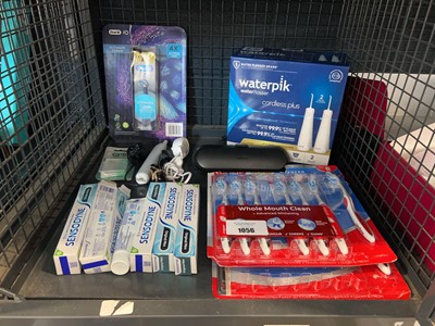 Lot 1056 - Cage containing dental hygiene products...