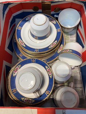 Lot 1076 - Box containing a blue, white and gilt...