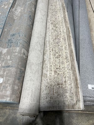Lot 1472 - Brown and beige patterned area rug