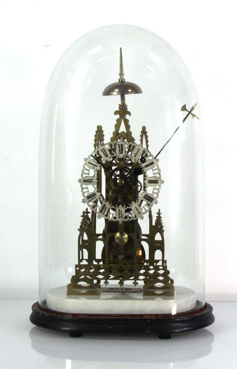Lot 78 - A late 19th century brass skeleton clock...