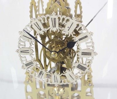 Lot 78 - A late 19th century brass skeleton clock...