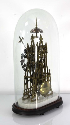 Lot 78 - A late 19th century brass skeleton clock...