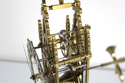 Lot 78 - A late 19th century brass skeleton clock...