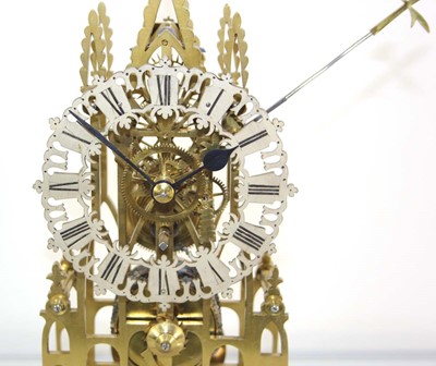 Lot 78 - A late 19th century brass skeleton clock...