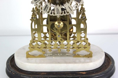 Lot 78 - A late 19th century brass skeleton clock...