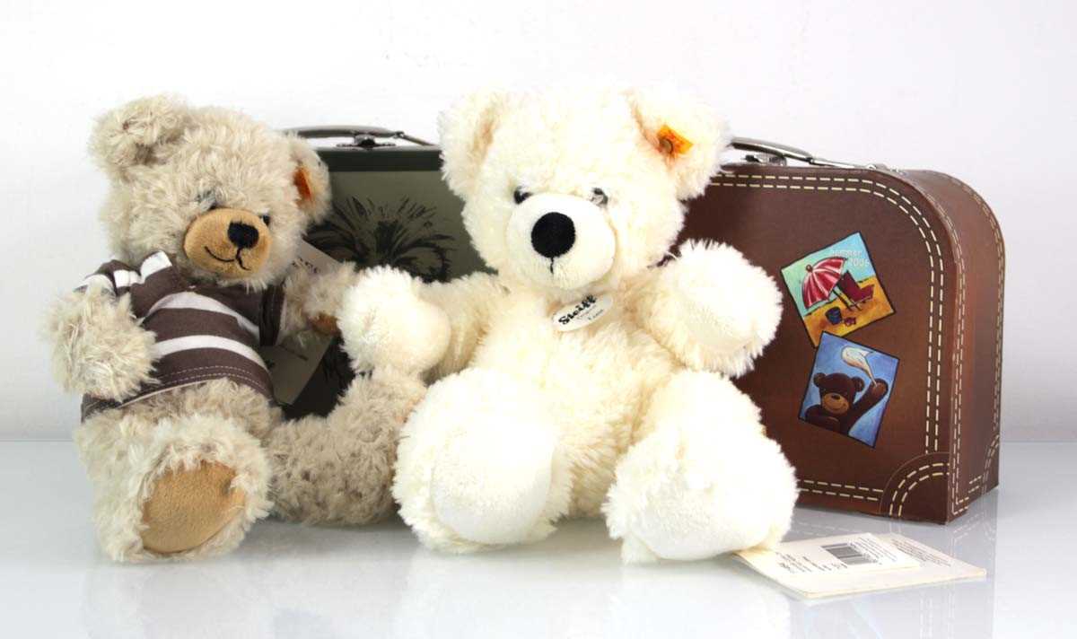Lot 133 - Two plush Steiff bears, each with a luggage...