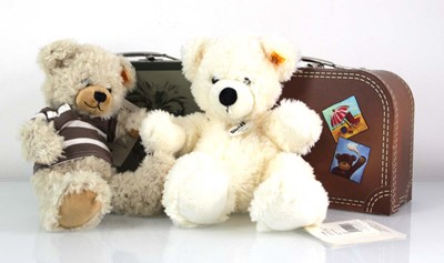 Lot 133 - Two plush Steiff bears, each with a luggage...