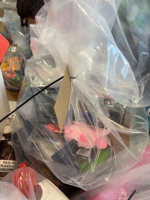 Lot 2225 - A bag containing a selection of dog toys and...