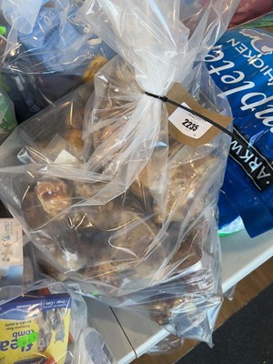 Lot 2235 - A bag containing a selection of dog treats to...