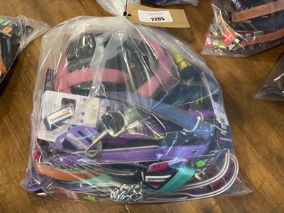 Lot 2265 - A bag containing a selection of dog leads &...