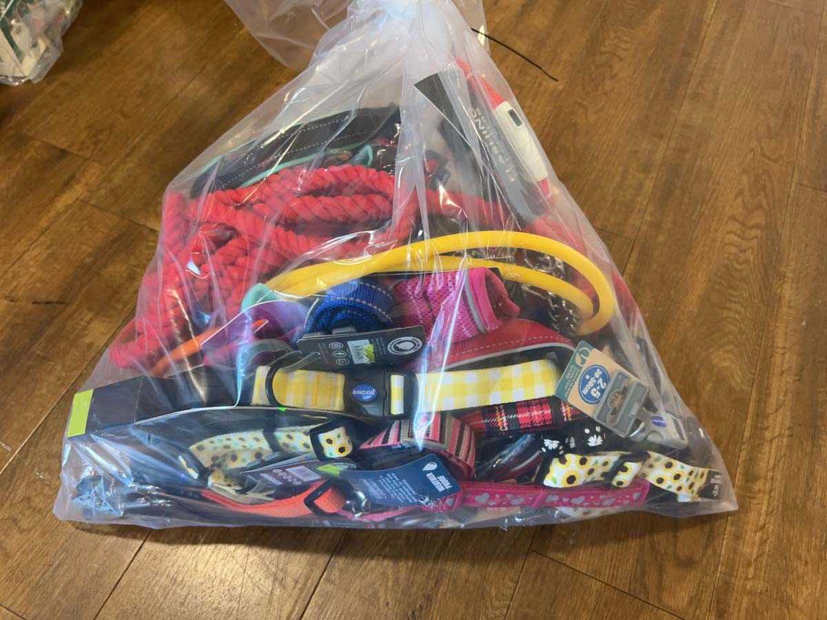 Lot 2274 - A bag containing a selection of dog leads,...