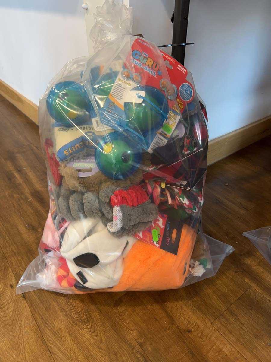 Lot 2275 - A bag containing a selection of dog toys