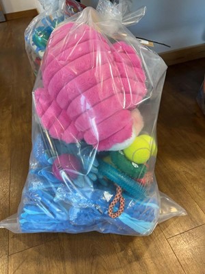 Lot 2276 - A bag containing a selection of dog toys