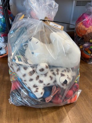 Lot 2277 - A bag containing a selection of dog toys