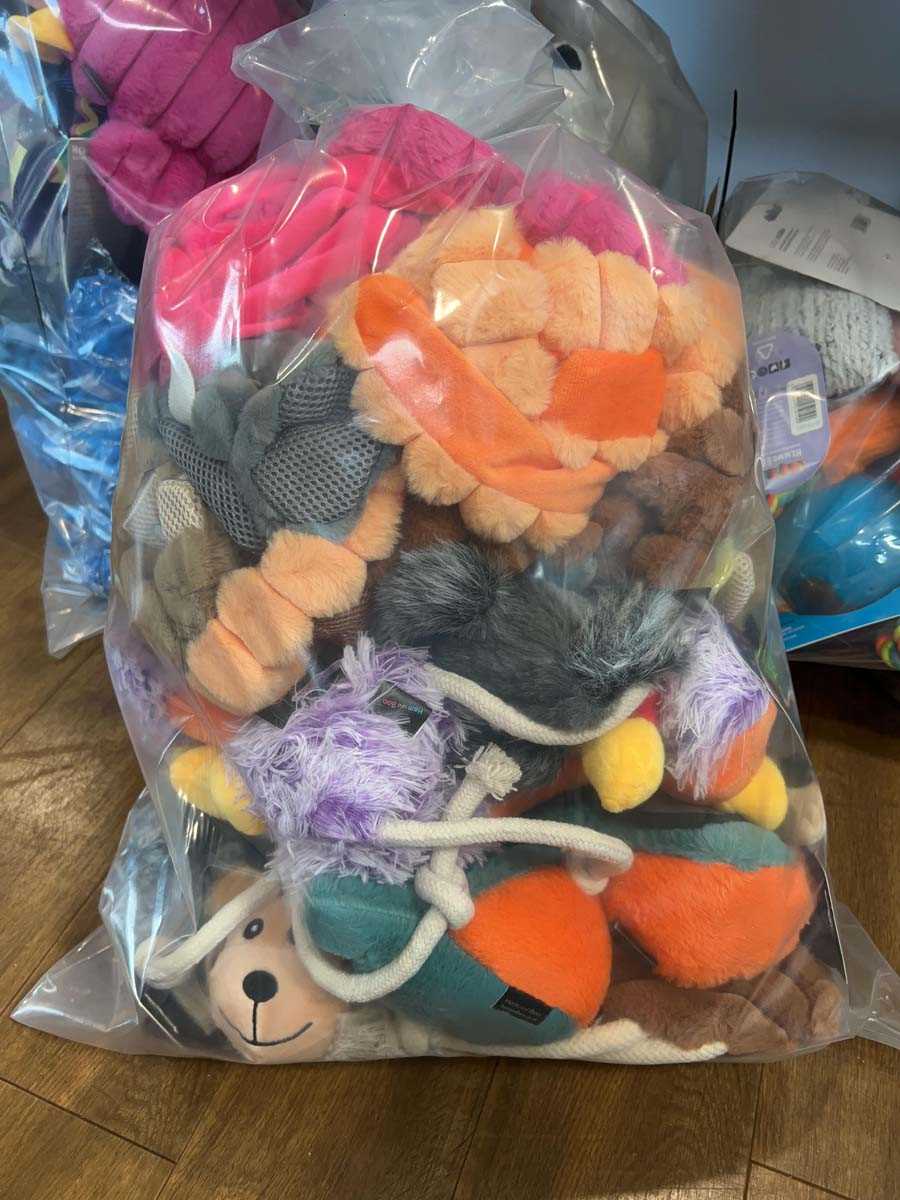Lot 2278 - A bag containing a selection of dog toys by...