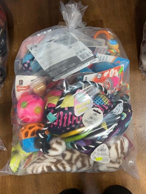 Lot 2279 - A bag containing a selection of dog toys