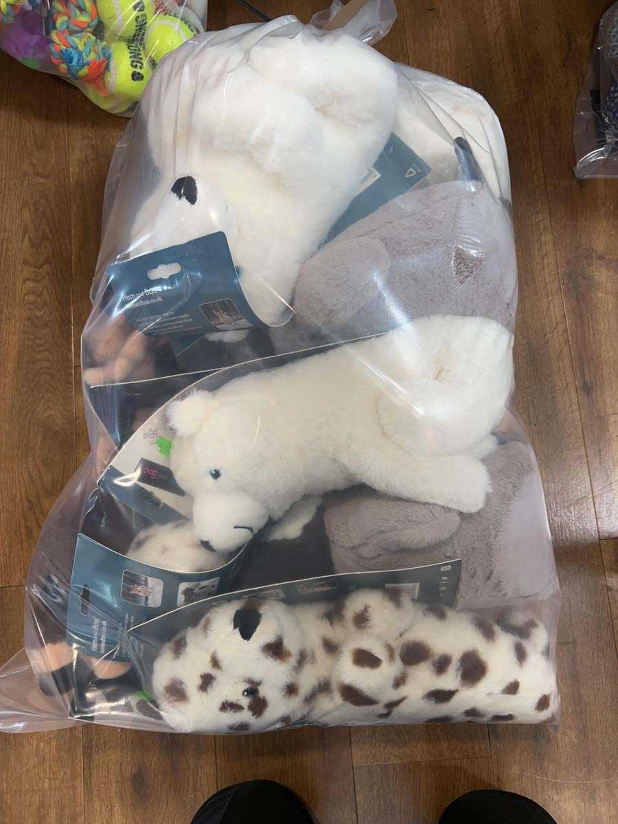 Lot 2280 - A bag containing a selection of dog toys by...