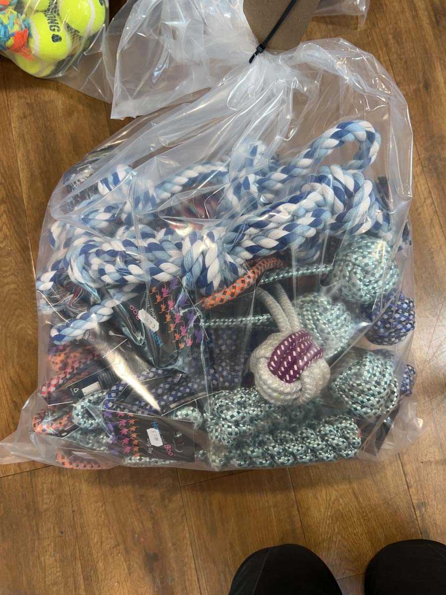 Lot 2281 - A bag containing a selection of dog rope toys...