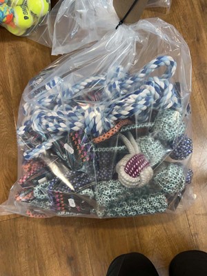 Lot 2281 - A bag containing a selection of dog rope toys...