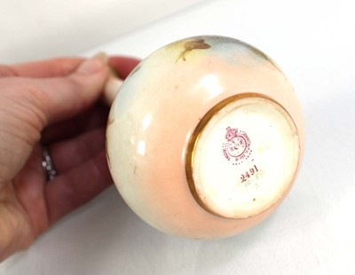 Lot 155 - A Royal Worcester ewer of squat form decorated...