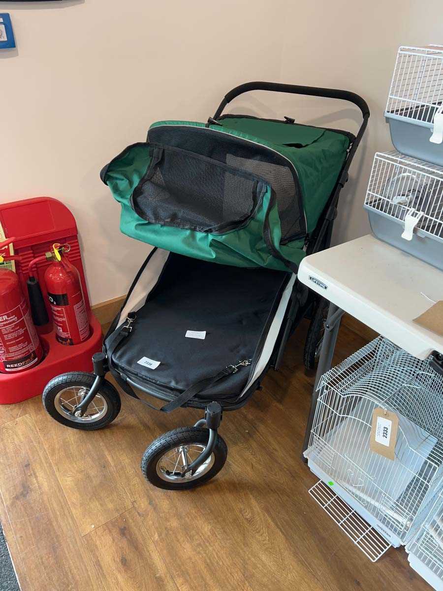 Lot 2338 - 4 wheel black and green pet stroller