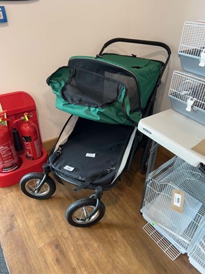 Lot 2338 - 4 wheel black and green pet stroller