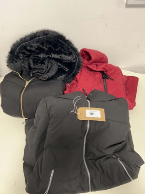 Lot 1711 - Bag containing x3 ladies coats by DKNY & Halston.