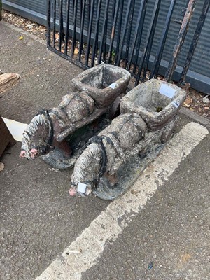 Lot 4226 - Two concrete garden ornaments of cart horses...