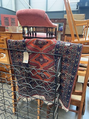 Lot 5221 - Red ground rug with blue borders