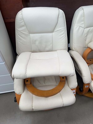 Lot 5257 - Lifelook cream swivel armchair along with a...