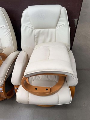 Lot 5258 - Lifelook cream swivel armchair along with a...