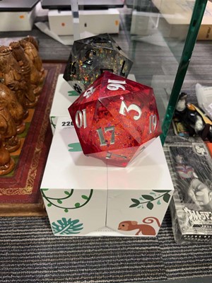 Lot 2205 - 2 boxed liquid 20 sided wild earth dice