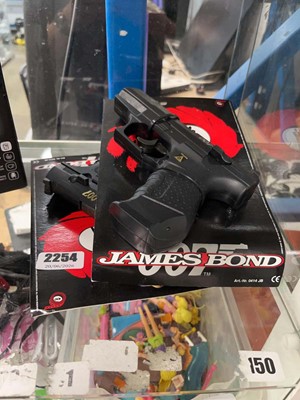 Lot 2254 - Three toy James Bond guns