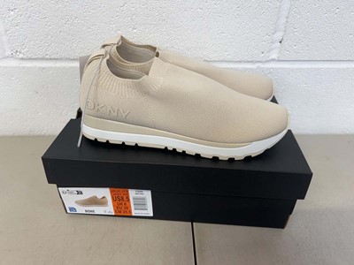 Lot 1819 - Boxed pair of DKNY slip on trainers size UK 6