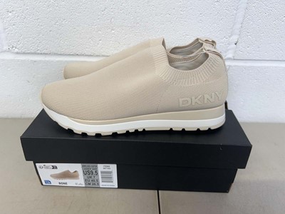 Lot 1820 - Boxed pair of DKNY slip on trainers size UK 7