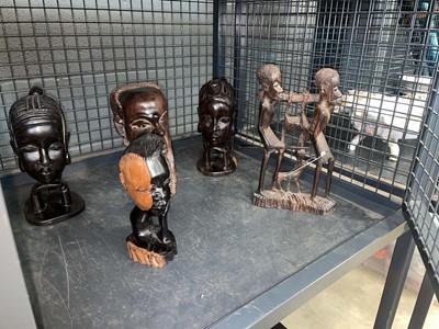 Lot 5489 - Cage containing tribal figural groups